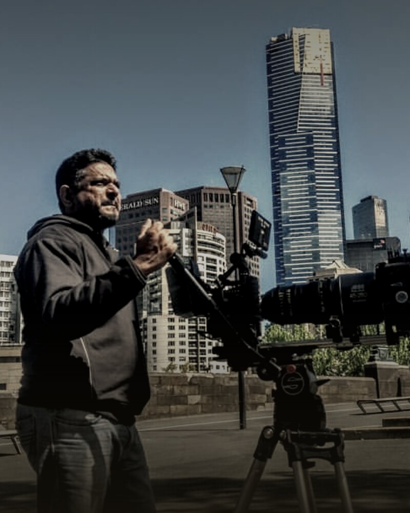 Sharon Samuel beside a film camera